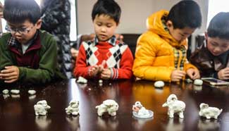 Children mould flour goats to greet Lantern Festival in E China