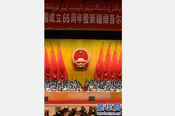 10月1日，慶祝中華人民共和國成立66周年暨新疆維吾爾自治區(qū)成立60周年大會在新疆人民會堂隆重舉行。 新華社記者 高潔 攝 