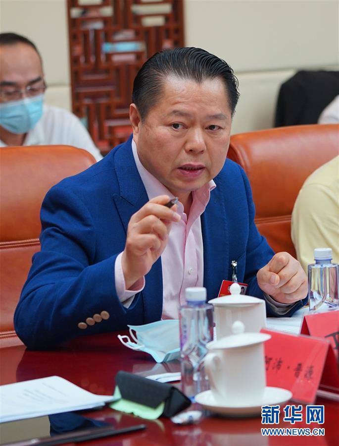 （兩會&middot;熱點畫報）（6）代表委員建言統(tǒng)籌做好經濟社會發(fā)展工作